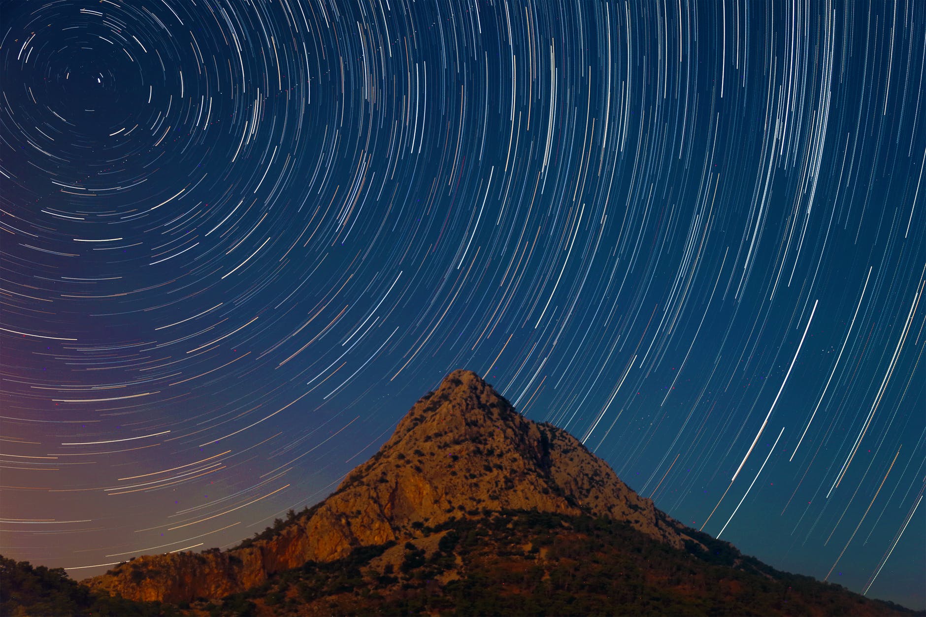 mountain under a starry sky in timelapse mode